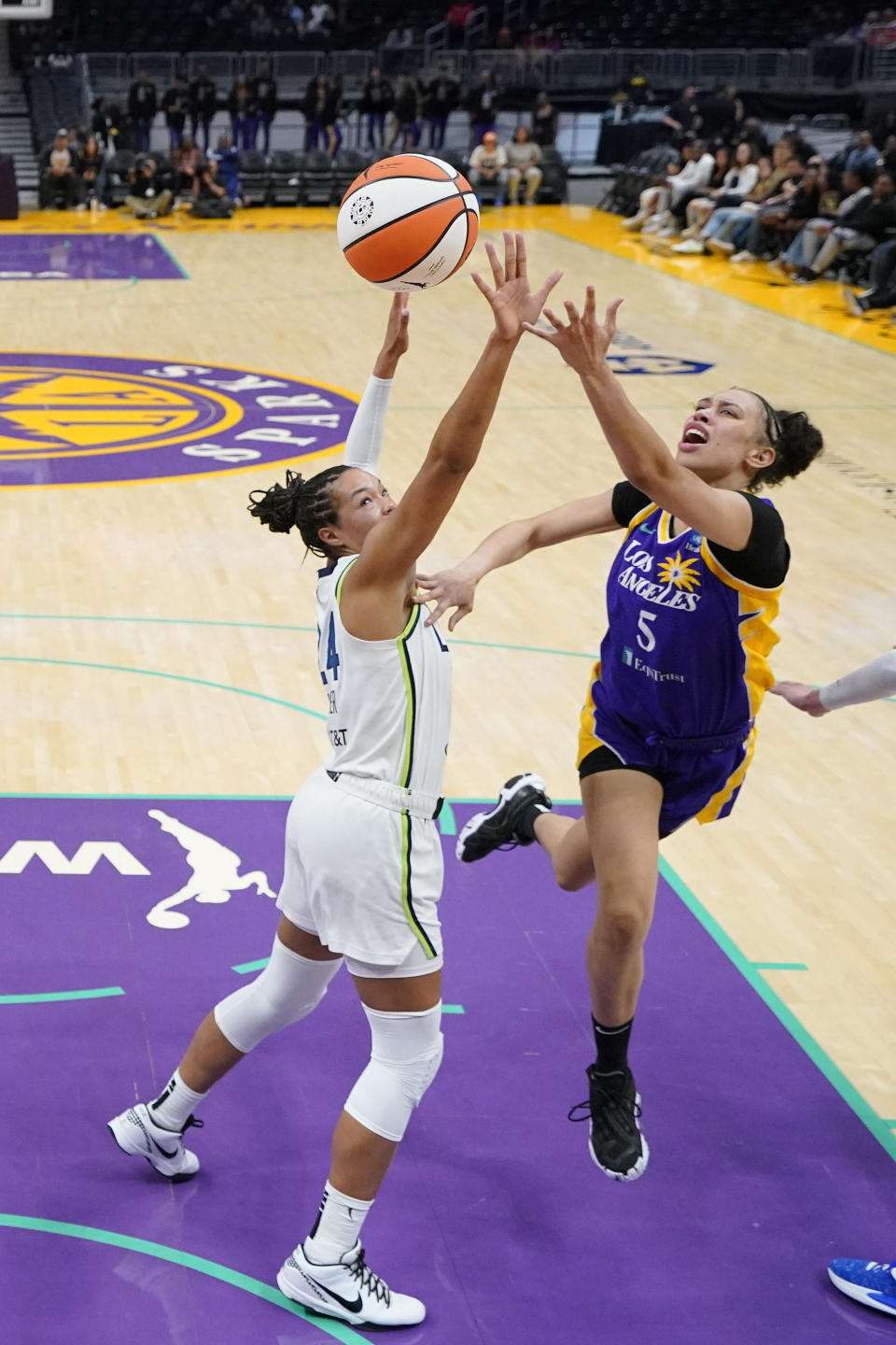 Los Angeles Sparks forward Dearica Hamby, right, shoots as Minnesota Lynx forward Napheesa Collier defends during the first half of a WNBA basketball game Tuesday, June 20, 2023, in Los Angeles. (AP Photo/Mark J. Terrill)