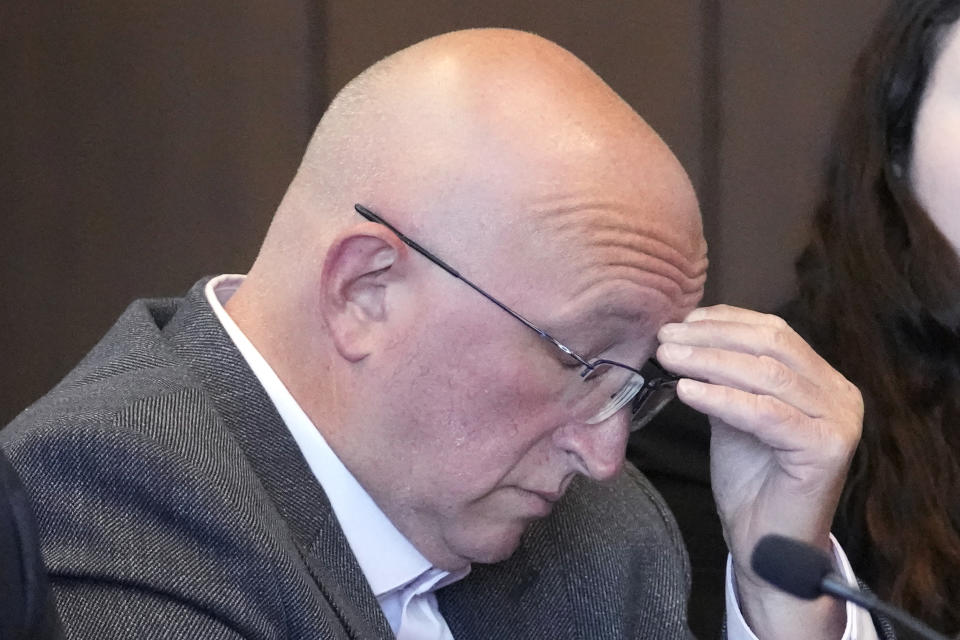 Robert E. Crimo Jr., listens during an appearance before Judge George D. Strickland at the Lake County Courthouse, Friday, July 14, 2023, in Waukegan, Ill. Judge Strickland on Friday set a Nov. 6 trial date for Crimo Jr. who is charged with helping his son obtain a gun license three years before the son allegedly shot dead seven people at a Fourth of July parade in suburban Chicago last year. (AP Photo/Nam Y. Huh, Pool)