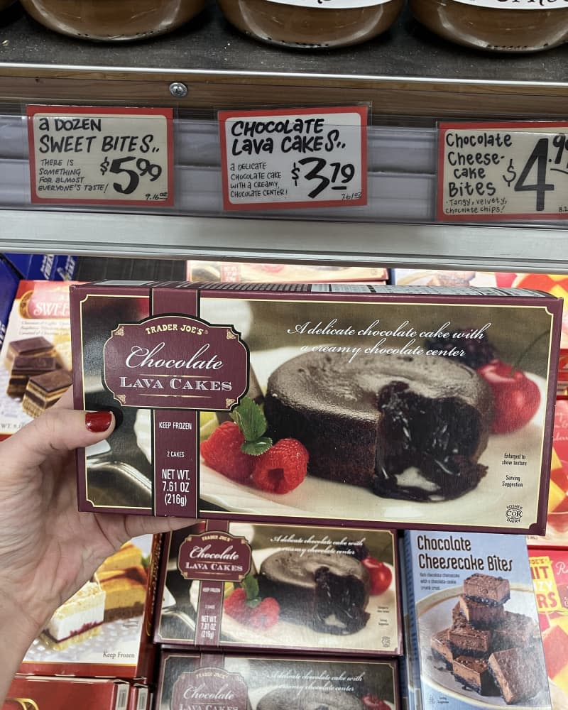 someone holding Chocolate Lava Cakes at Trader Joe's store