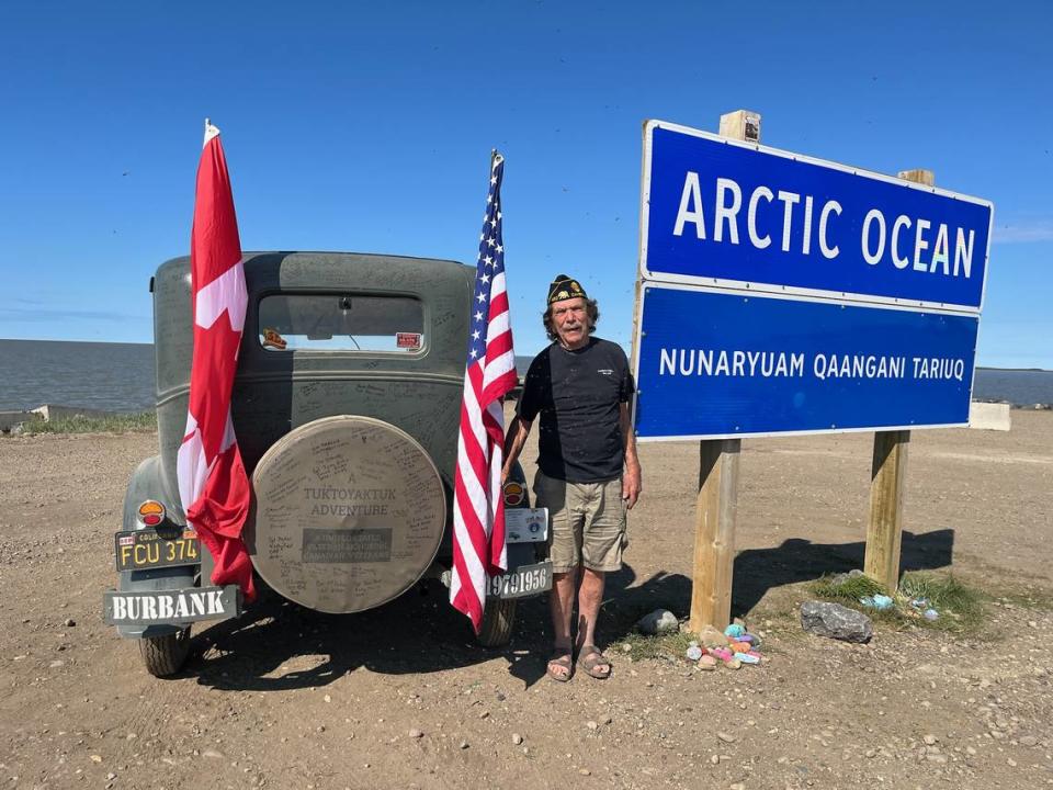 Jay Burbank stands with his 1931 Model A Ford at the shore of the Arctic Ocean in Tuktoyatuk, in the northern Canadian territories, on July 2, 2023, after a 7,000-mile, nearly monthlong drive from Cambria. Burbank organized the trip to honor veterans in the U.S. and Canada, hundreds of whom signed the antique vehicle.