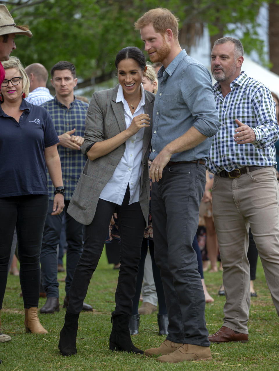 Britain's Prince Harry and Meghan, Duchess of Sussex attend a community picnic at Victoria Park in Dubbo, Australia, Wednesday, Oct. 17, 2018. Prince Harry and his wife Meghan are on day two of their 16-day tour of Australia and the South Pacific. (Ian Vogler/Pool via AP)