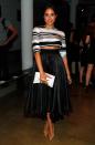 <p>Markle wears a tea-length black skirt and striped top while attending the Peter Som fashion show during Mercedes-Benz Fashion Week.</p>