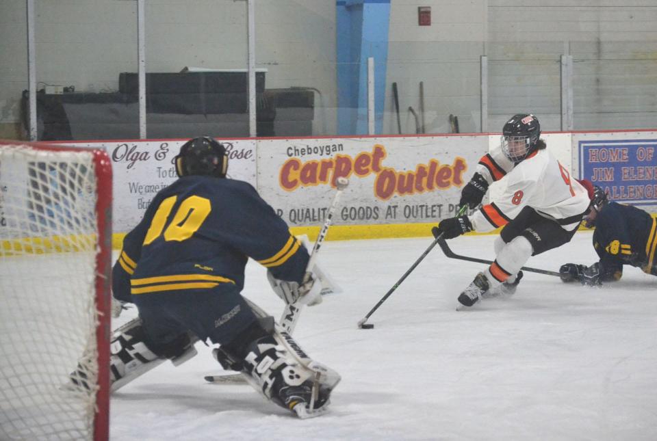 Cheboygan's Carson Bigger (8) gets ready to fire a shot against Cadillac goaltender Dakota Vail during the first period on Tuesday.