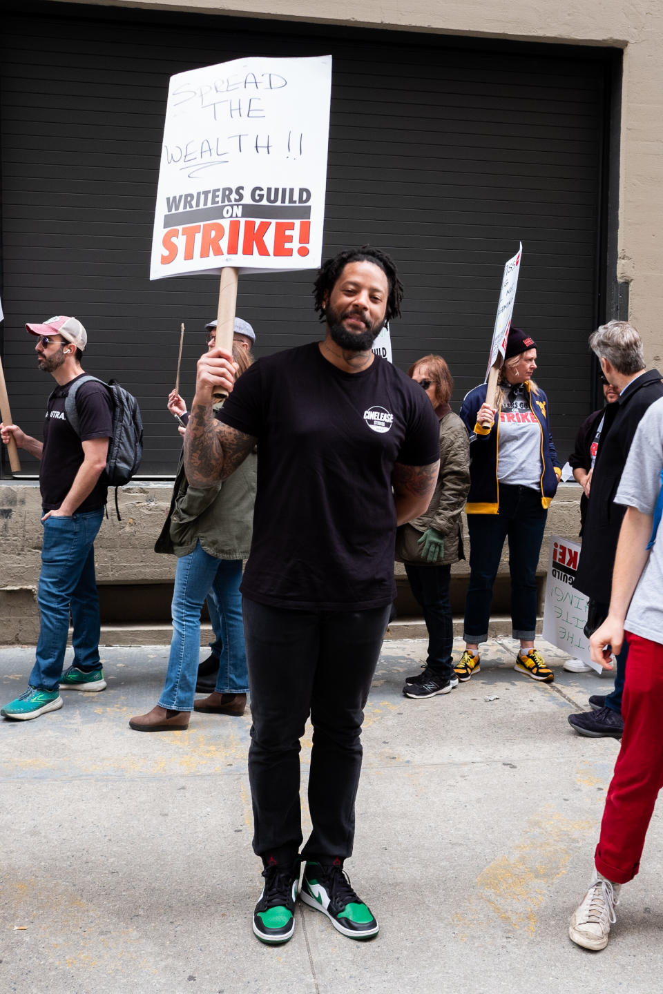 man standing and posing at the WGA strike