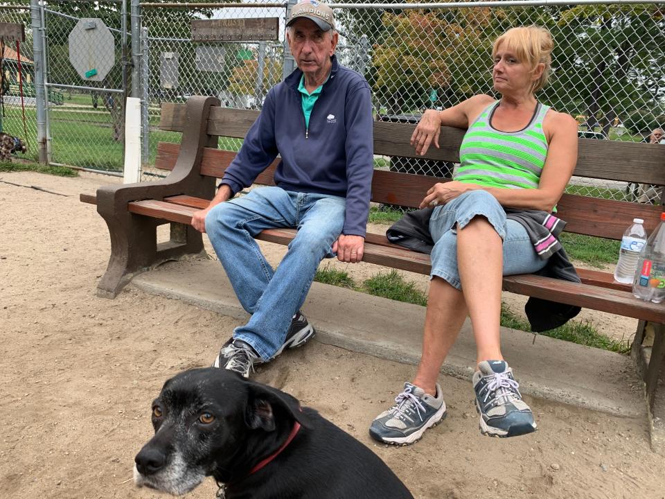 Bob Rossi and Rosann Santos often see each other at the dog park at Slater Memorial Park, where they, and their dogs, socialize. Rossi's black lab and beagle mix, Luna, often spends her day sitting next to her owner.