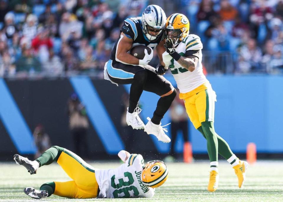 Carolina Panthers tight end Tommy Tremble (82) collides with Green Bay Packers cornerback Jaire Alexander (23) during the game at Bank of America Stadium on Sunday, December 24, 2023.