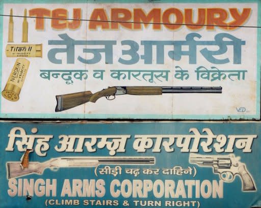 The sign of a gun shop is seen here in New Delhi. Gun crime and armed robbery in India is still low by the standards of other developing countries in Latin America or Africa