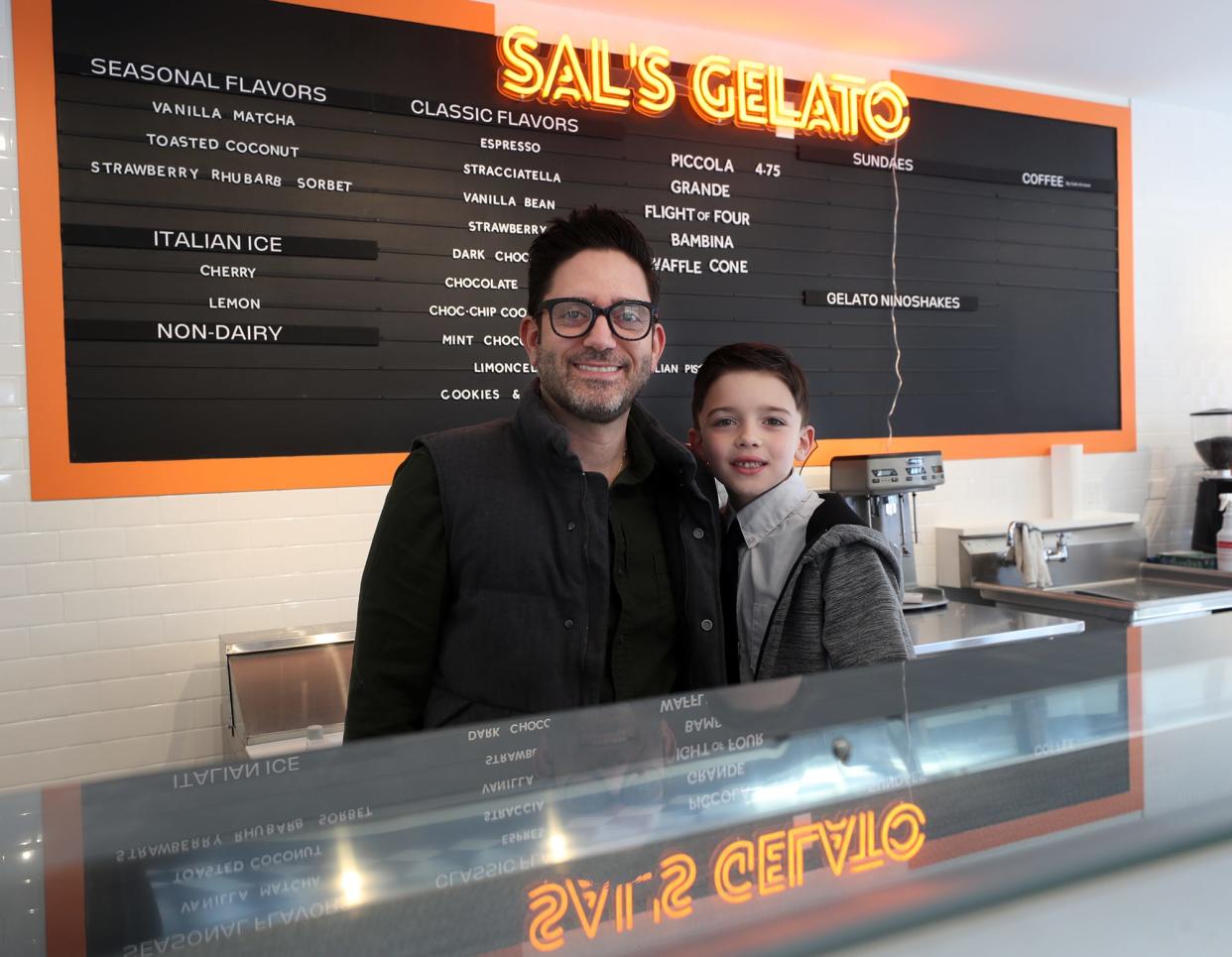 Michael Maghes, co-owner, and his son Salvatore, 7, stand behind the counter last week at the soon-to-open Sal's Gelato on Merriman Road in Akron's Merriman Valley.