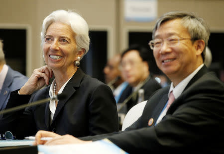 International Monetary Fund (IMF) Managing Director Christine Lagarde (L) and Governor of the People's Bank of China Yi Gang attend a thematic forum of the second Belt and Road Forum for international cooperation in Beijing, China, April 25, 2019. REUTERS/Jason Lee