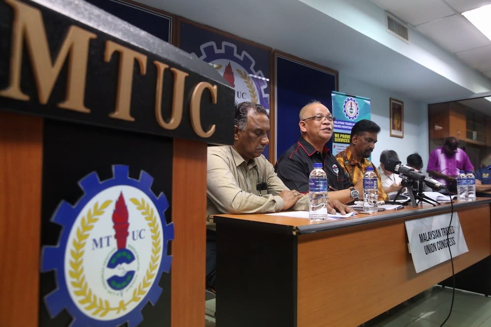 (From left) MTUC vice-president (private sector) R. Jey Kumar, president Datuk Abdul Halim Mansor and secretary-general J. Solomon attend a press conference in Subang Jaya December 26, 2019. — Picture by Choo Choy May