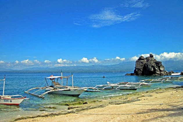 <strong>Islands off Dumaguete: Apo and Siquijor</strong>. Both islands are accessible via the seaport city of Dumaguete for some easy day trips. Apo Island (in the photo), may not be much to look at, beach-wise, but underwater is a whole different story. The marine sanctuary is considered by many divers as one of the world’s best and UK-based magazine, Sport Diver, agreed, including it their list of world’s “ultimate dive destinations” a few years back.