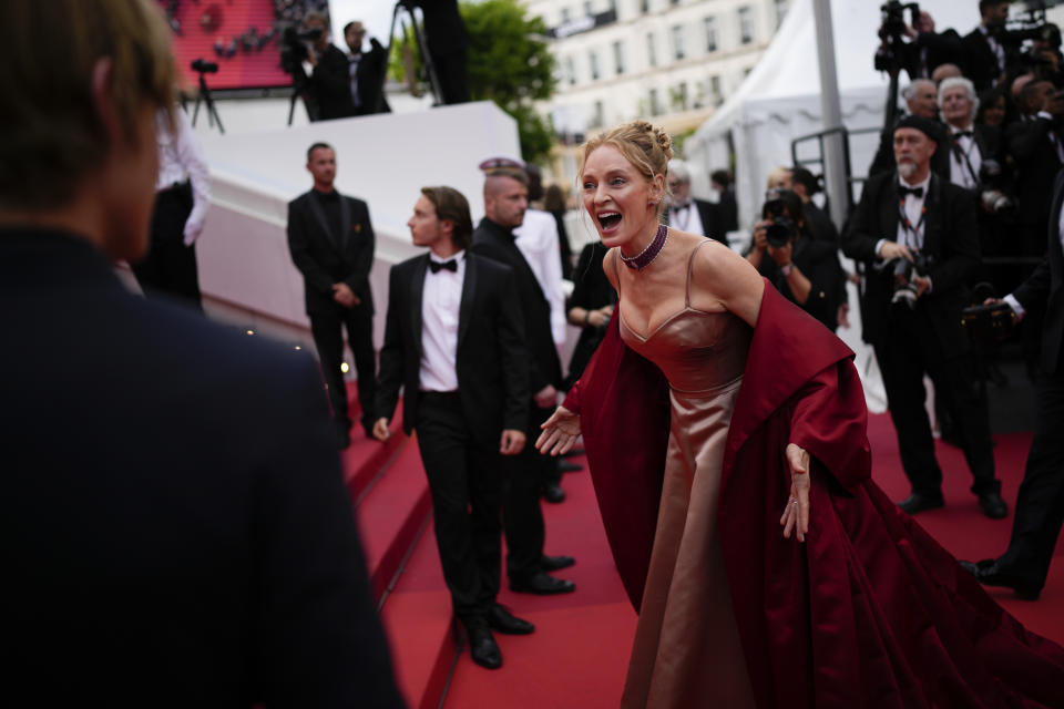 Uma Thurman poses for photographers upon arrival at the opening ceremony and the premiere of the film 'Jeanne du Barry' at the 76th international film festival, Cannes, southern France, Tuesday, May 16, 2023. (AP Photo/Daniel Cole)