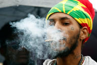 <p>Jerome Waite, known by his spiritual name Rasfia, smokes a marijuana cigarette, during a rally to support the legalization of marijuana on Capitol Hill in Washington, Monday, April 24, 2017. Waite was later arrested. Smoking pot in public remains illegal everywhere in Washington. (AP Photo/Alex Brandon) </p>