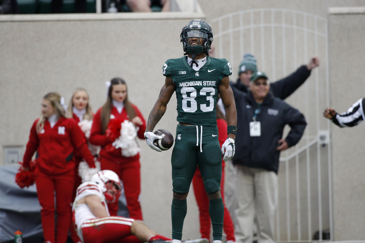 Michigan State wide receiver Montorie Foster Jr. (83) celebrates his touchdown reception against Nebraska during an NCAA college football game, Saturday, Nov. 4, 2023, in East Lansing, Mich. (AP Photo/Al Goldis)