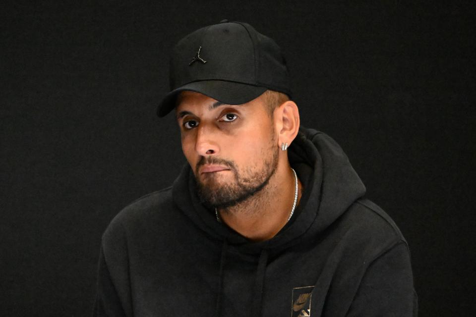 Nick Kyrgios, pictured here speaking during a press conference to announce his withdrawal from the Australian Open.