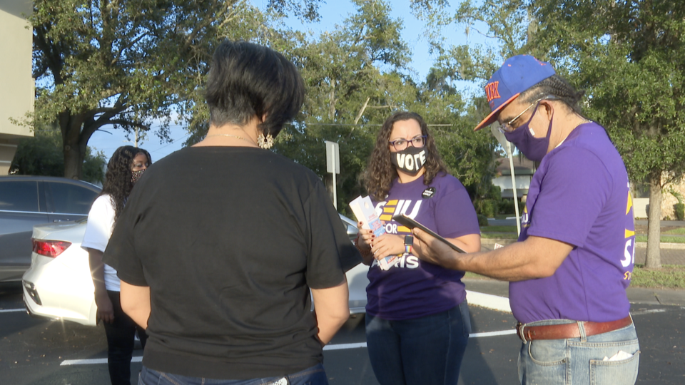 SEIU members meet before canvassing in neighborhood in Orlando, Florida. / Credit: CBS News / LaCrai Mitchell