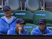 Maria Sharapova's entourage with some concerned looks.