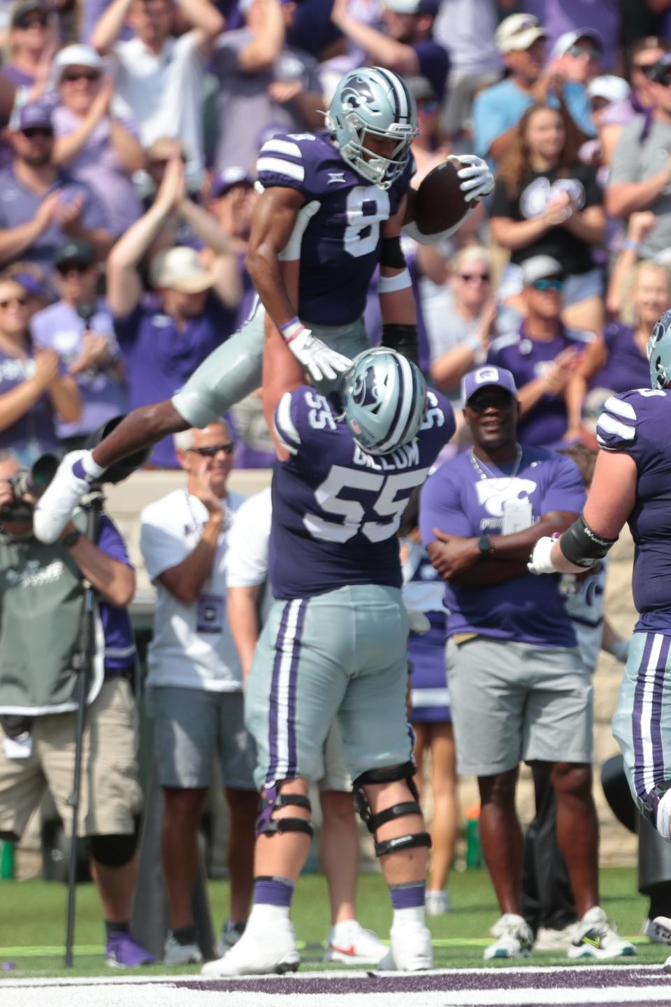 Kansas State wide receiver Phillip Brooks (8) is lifted off the ground by center Hayden Gillum (55) after scoring on a 2-yard run in the second quarter Saturday against Troy at Bill Snyder Family Stadium.