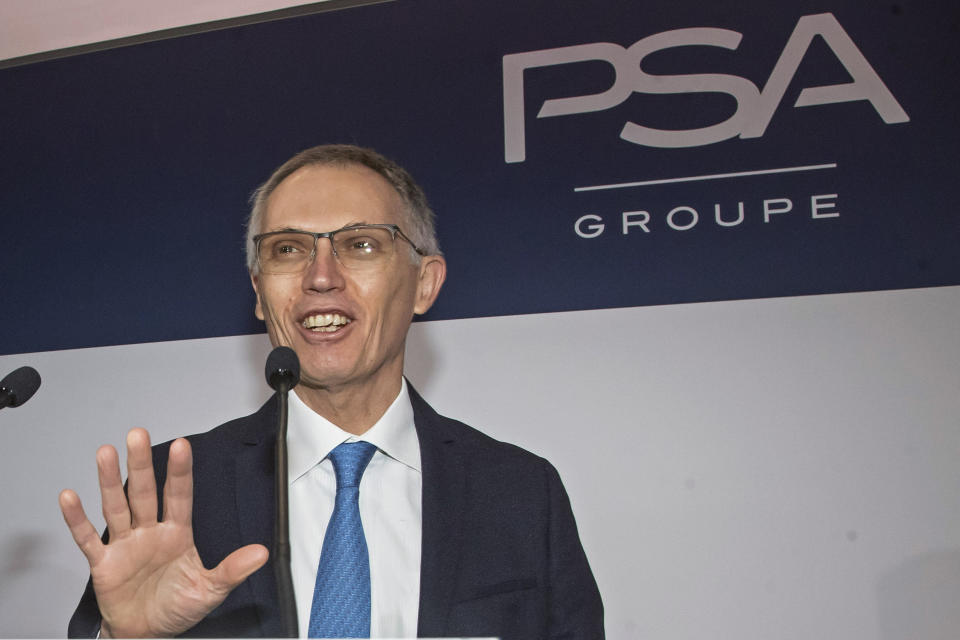 FILE - In this Wednesday, Feb. 26, 2020 file photo, CEO of PSA Groupe Carlos Tavares arrives for the presentation of the company's 2019 full year results in Rueil-Malmaison, west of Paris. Carmaker Stellantis and Taiwan’s Foxconn on Tuesday announced plans to develop a jointly operated automotive supplier focusing on technology to make vehicles more connected, including artificial intelligence-based applications and 5-G communications. Stellantis CEO Carlos Tavares said that the services that will be developed through the tie-up “will mark the next great evolution of our industry,” alongside fully electrified and hybrid powertrains (AP Photo/Michel Euler, File)