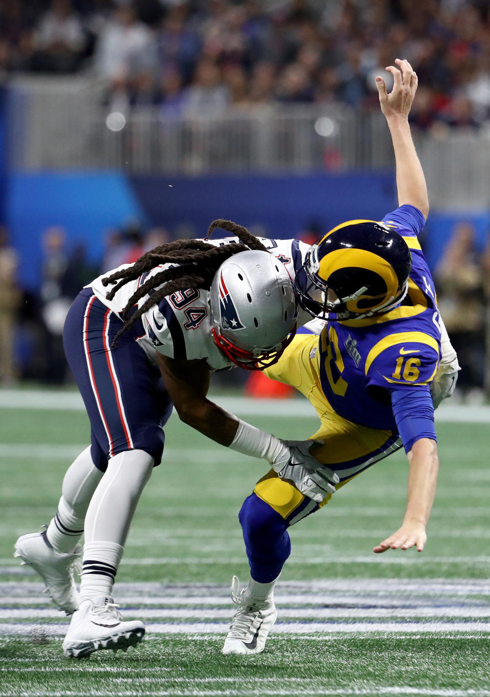 <p>Jared Goff #16 of the Los Angeles Rams is tackled by Adrian Clayborn #94 of the New England Patriots in the first quarter during Super Bowl LIII at Mercedes-Benz Stadium on February 03, 2019 in Atlanta, Georgia. (Photo by Al Bello/Getty Images) </p>