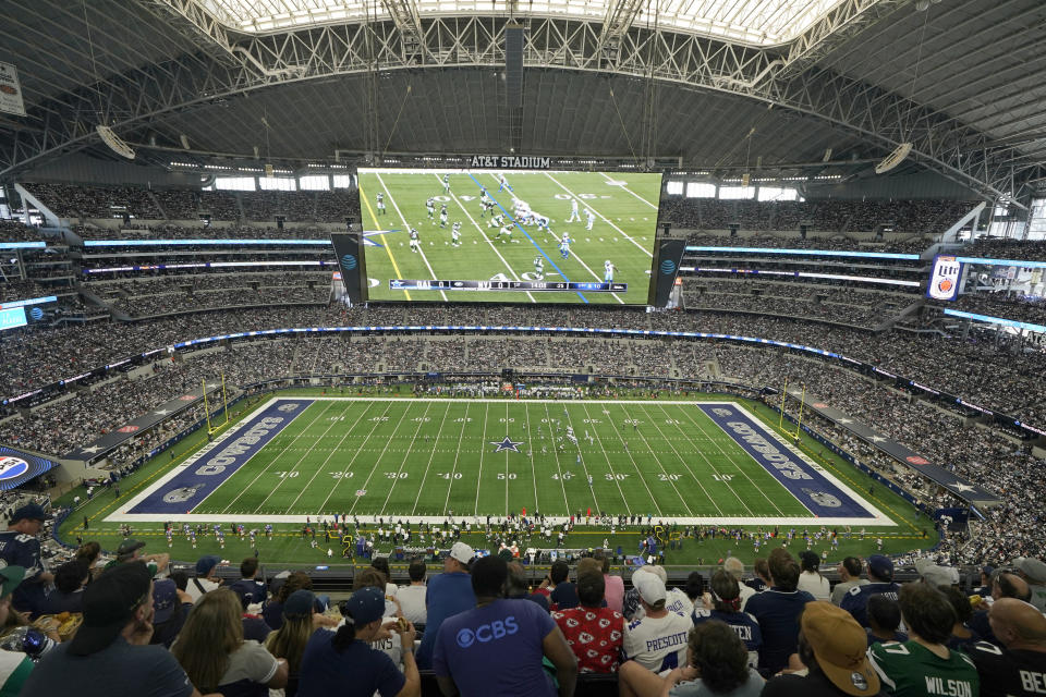 FILE - The New York Jets and Dallas Cowboys are shown on the large video screen at AT&T Stadium as they play in the first half of an NFL football game in Arlington, Texas, Sunday, Aug. 17, 2023. MetLife Stadium officials plan to remove 1,740 seats to widen the field for World Cup matches as they hope to host the 2026 final. The stadium in New Jersey is among contenders for the final, along with AT&T Stadium. (AP Photo/Tony Gutierrez, FIle)