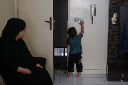 Emad, two, plays at his relative's home in south of Tehran, Iran, June 18, 2017. Nazanin Tabatabaee Yazdi / TIMA via REUTERS