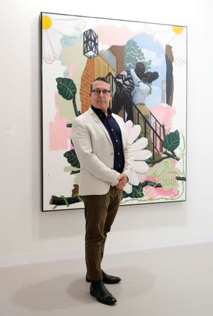 Gallerist Jack Shainman poses in front of "Vignette (The Kiss)" (2018) of U.S. artist Kerry James Marshall during the Art Basel in Basel, Switzerland, June 13, 2018. REUTERS/Moritz Hager