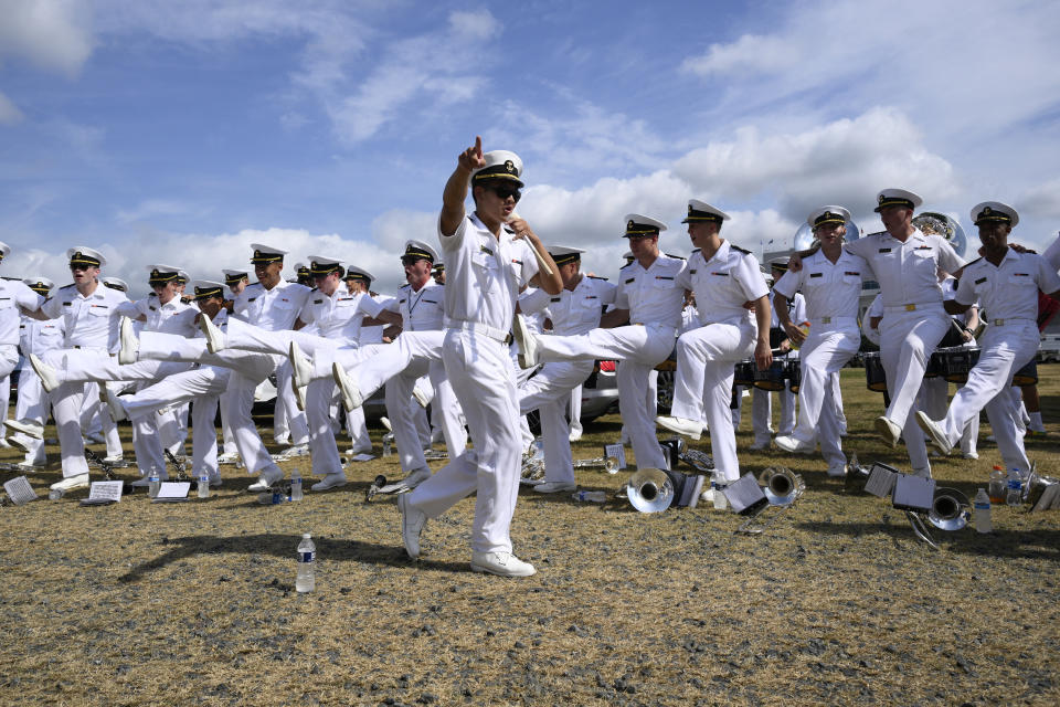 US Naval Academy Drum & Bugle Corps perform for tailgaters before an NCAA college football game between Navy and Delaware, Saturday, Sept. 3, 2022, in Annapolis, Md. (AP Photo/Nick Wass)