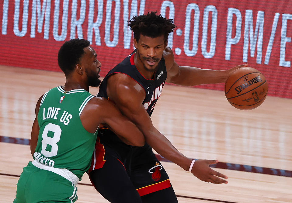 Jimmy Butler #22 of the Miami Heat drives the ball against Kemba Walker #8 of the Boston Celtics during the third quarter in Game Four of the Eastern Conference Finals 