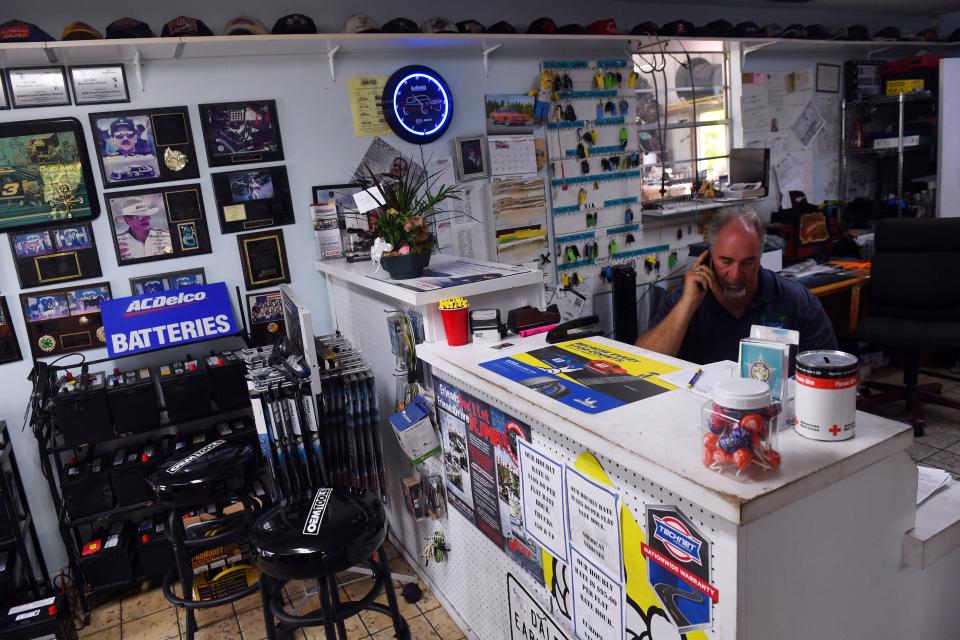 "Now I have to pick up most of the office work that my brother used to do," said Bobby Ford as he makes phone calls on Wednesday, Sept. 1, 2021 at Bobby's Auto Service Center in Vero Beach. Ford's twin brother, Billy, did most of the office work, but was infected with COVID-19 and died Aug. 14, Bobby Ford said. Billy Ford was unvaccinated.