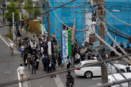 Members of the media gather at the site where a stabbing incident occured in Kawasaki city, Japan May 28, 2019. REUTERS/Issei Kato