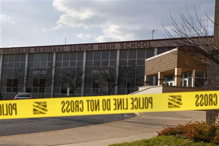 Police tape is seen outside Franklin Regional High School after a series of knife attacks in Murrysville, Pennsylvania April 9, 2014. REUTERS/Shannon Stapleton
