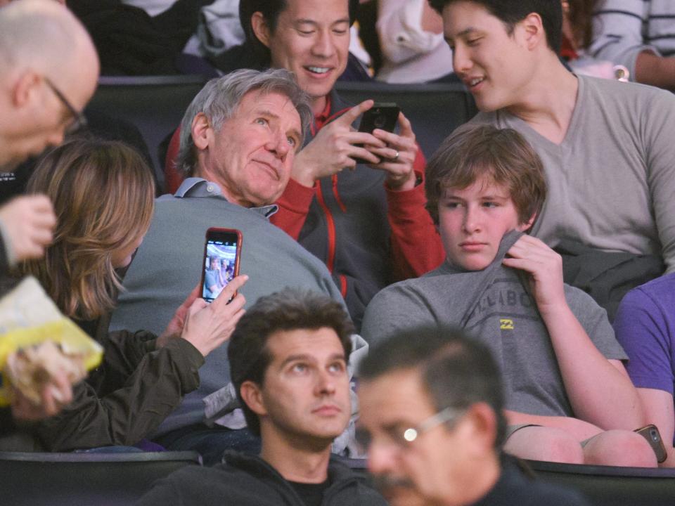 Harrison Ford and his adopted son Liam Ford at a basketball game in 2016.