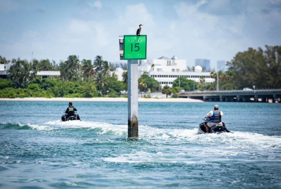 Miami-Dade Police marine patrol officers monitor the water on jet skis near Crandon Park Marina on Wednesday, July 3, 2024, in Key Biscayne, Florida.
