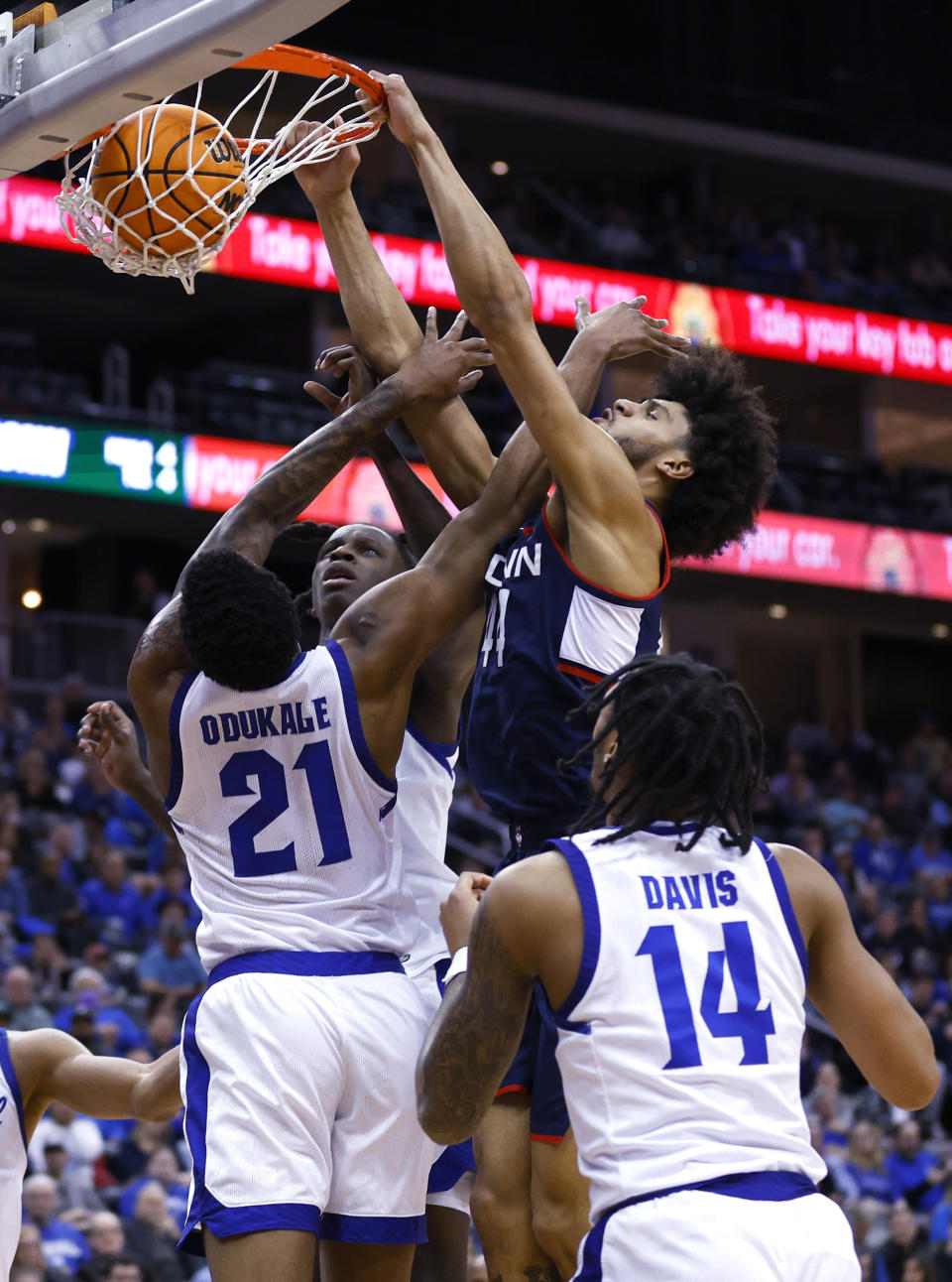 UConn guard Andre Jackson Jr. (44) dunks against Seton Hall guards Femi Odukale (21) and Dre Davis (14) during the first half of an NCAA college basketball game in Newark, N.J., Wednesday, Jan. 18, 2023. (AP Photo/Noah K. Murray)