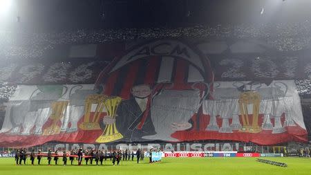 Football Soccer - AC Milan v Inter Milan - Italian Serie A - San Siro stadium, Milan, Italy - 20/11/16 - AC Milan's supporters hold up a giant banner before the match. REUTERS/Alessandro Garofalo