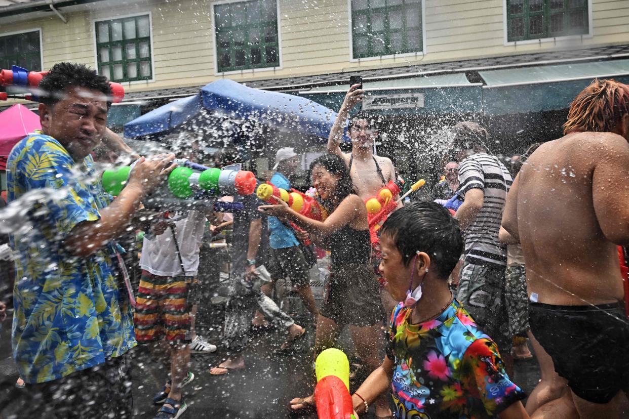 April 13, 2023: People take part in mass water fights during the first day of Songkran, or Thai New Year, on Khao San Road in Bangkok.
