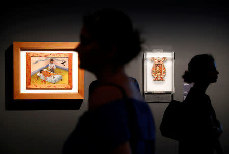 Visitors attend the "Frida Kahlo: Masterpieces from the Museo Dolores Olmedo, Mexico City" exhibition at the Hungarian National Gallery in Budapest, Hungary, August 2, 2018. REUTERS/Bernadett Szabo