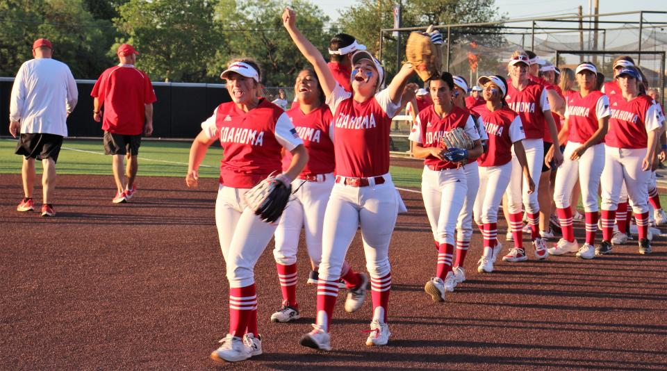 After shaking hands with their opponents, Coahoma players celebrate a 5-1 Game 1 over Holliday on Thursday at Wells Field at ACU. The win gives the Bulldogettes the lead in the Region I-3A title series that sends the winner to the state tourney. Game 2 is 2 p.m. Saturday, also at Wells.