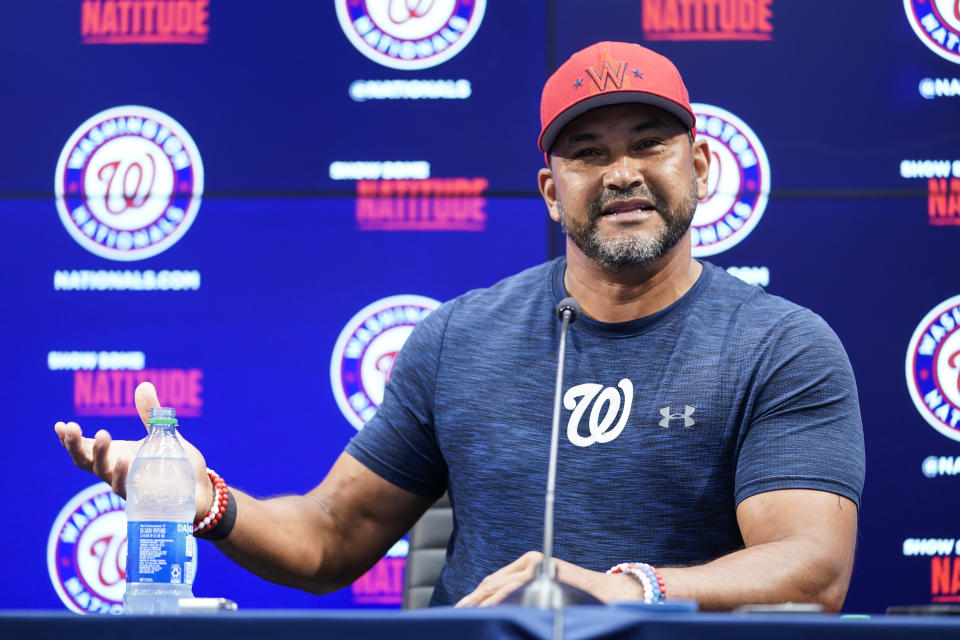 Washington Nationals manager Dave Martinez speaks with reporters about the team's recent trades before a baseball game against the New York Mets at Nationals Park, Tuesday, Aug. 2, 2022, in Washington. (AP Photo/Alex Brandon)
