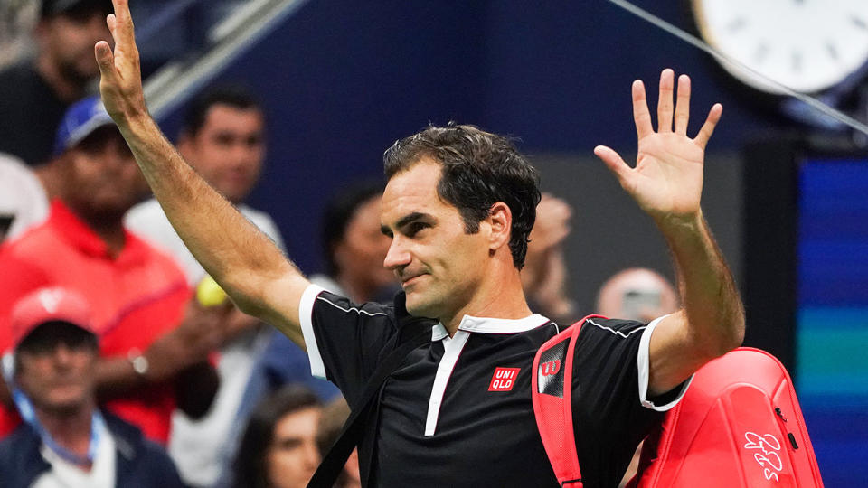 Roger Federer waves goodbye to the crowd after his shock quarter-final defeat. 