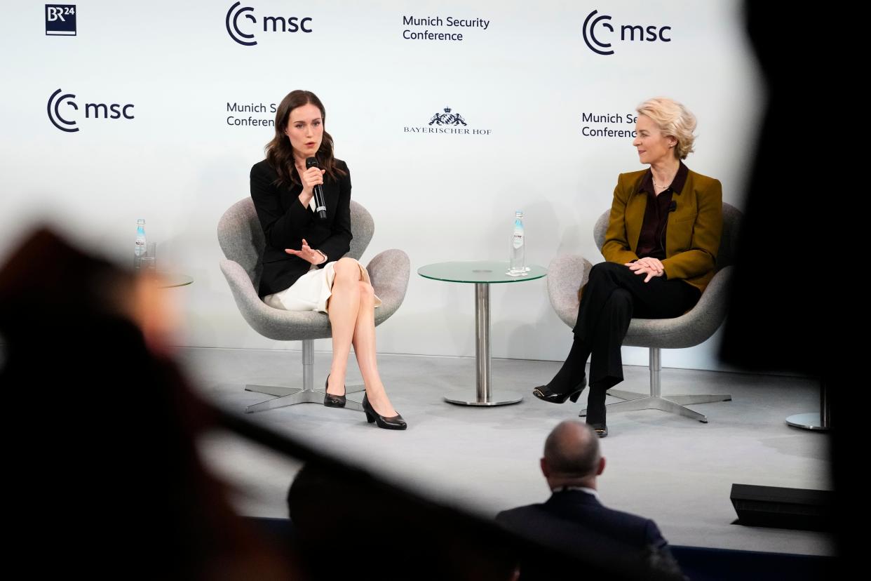 Finland's prime minister Sanna Marin, left, and European Commission president Ursula von der Leyen talk at the Munich Security Conference (AP Photo/Petr David Josek)