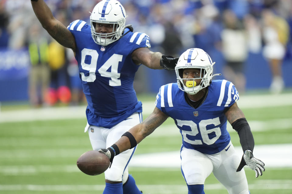 Indianapolis Colts safety Rodney McLeod (26) celebrates an interception with Tyquan Lewis (94) during the second half of an NFL football game against the Kansas City Chiefs, Sunday, Sept. 25, 2022, in Indianapolis. (AP Photo/AJ Mast)