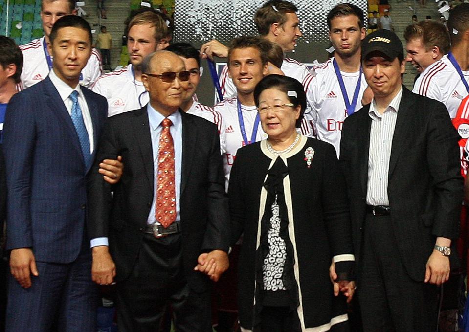 In this July 22, 2012 photo, the Rev. Sun Myung Moon, the founder of the Unification Church, second from left, poses with his wife Hak Ja Han Moon, second from right, his sons Hyung-jin Moon, left, and Kook Jin Moon during the closing ceremony of the 2012 Peace Cup Suwon at Suwon World Cup Stadium in Suwon, South Korea. Moon, the self-proclaimed messiah who founded the church, died Monday, Sept. 3, 2012, at a church-owned hospital near his home in Gapyeong County, northeast of Seoul, church officials said. He was 92. (AP Photo/Ahn Young-joon)