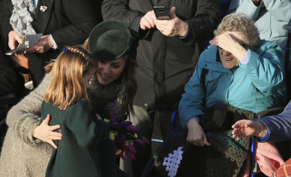 Catherine, Duchess of Cambridge and her daughter Princess Charlotte greet the public after attending a Christmas day service at the St Mary Magdalene Church in Sandringham in Norfolk, England, Wednesday, Dec. 25, 2019. (AP Photo/Jon Super)