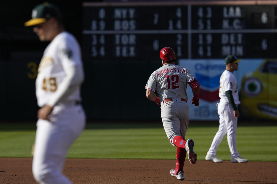Philadelphia Phillies' Kyle Schwarber (12) runs the bases after hitting a solo home run against the Oakland Athletics during the first inning of a baseball game in Oakland, Calif., Friday, June 16, 2023. (AP Photo/Godofredo A. Vásquez)