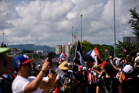 Demonstrators take part in the National Strike calling for the resignation of Governor Ricardo Rossello in San Juan