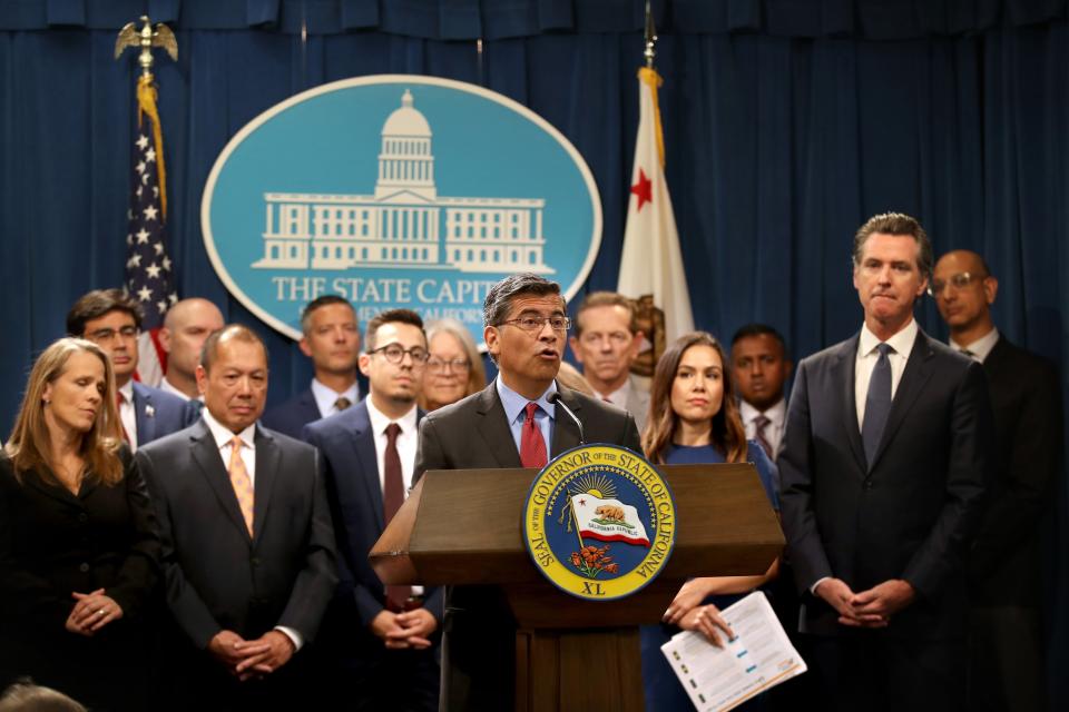 California attorney General Xavier Becerra appears for a news conference alongside Democratic California Gov. Gavin Newsom (right) on August 16, 2019 in Sacramento, Calif.