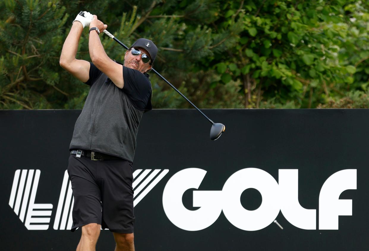 Phil Mickelson plays on the 18th, during the Pro-Am at the Centurion Club, in Hertfordshire, England, ahead of the LIV Golf Invitational Series, Wednesday June 8, 2022. (Steven Paston/PA via AP)