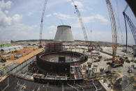 FILE- Construction continues on a new nuclear reactor at Plant Vogtle on June 13, 2014, in Waynesboro, Ga. Delays pushed back completion by years, more than doubling Vogtle’s projected costs. (AP Photo/John Bazemore, File)